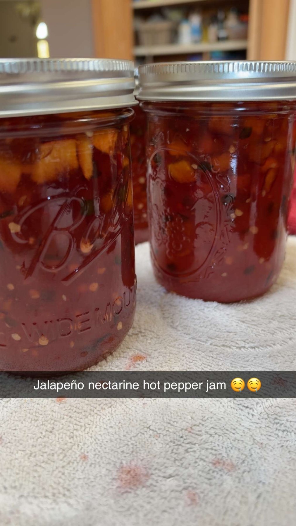 Close-up of jars filled with homemade jalapeño nectarine jam