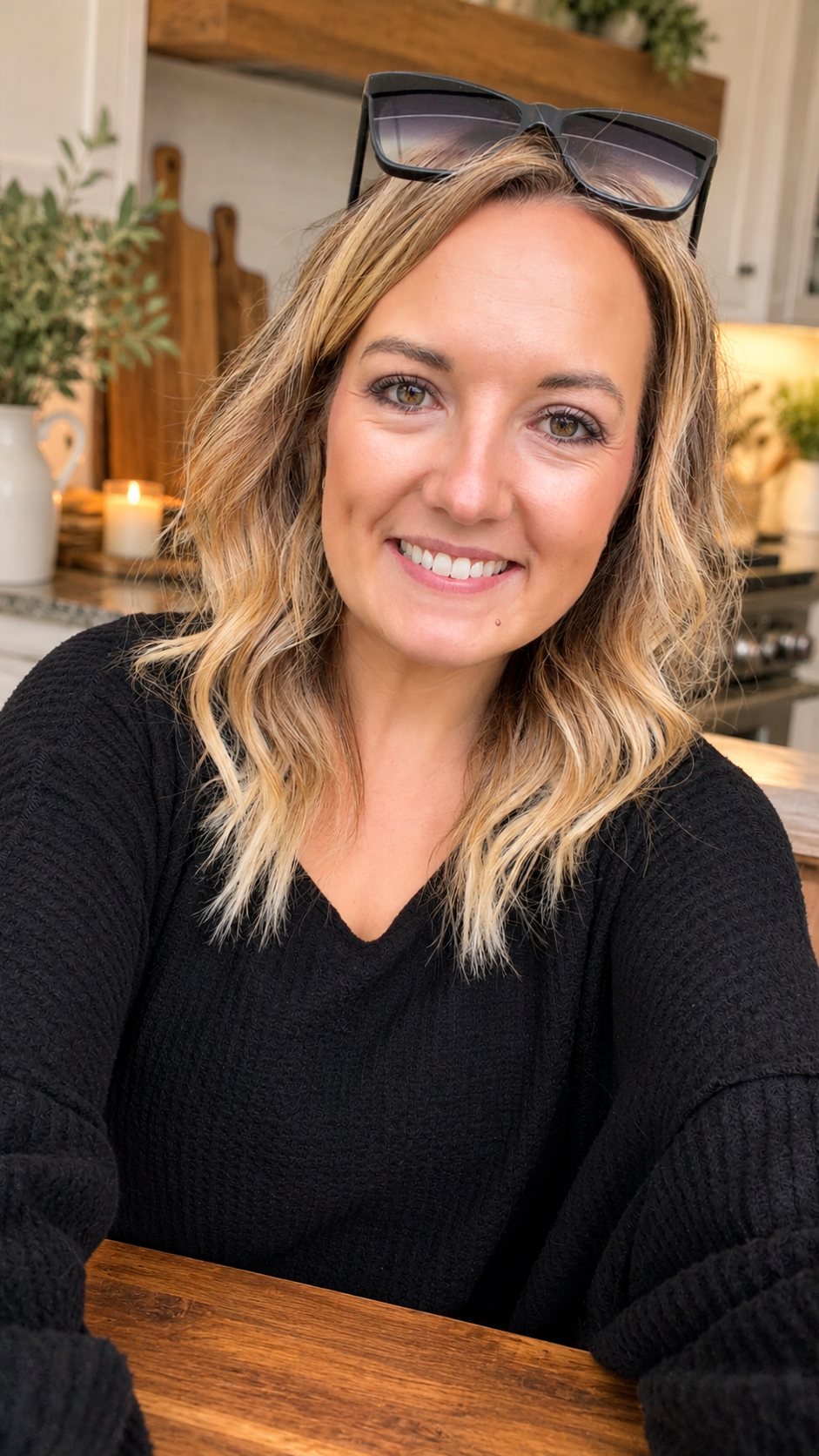 Jennifer smiling in a cozy kitchen